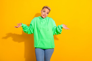 Portrait of pretty clueless person hands palms shrug shoulders isolated on yellow color background - obrazy, fototapety, plakaty