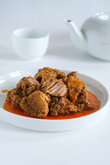 rendang is a spicy meat that slow cooked in coconut milk and mixed spices. traditional food Indonesia