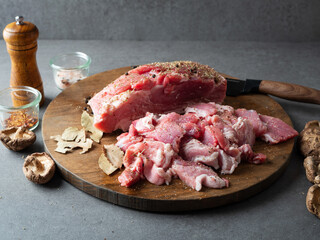 Sliced pork on a wooden cutting board