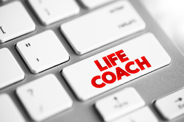 Life Coach - type of wellness professional who helps people make progress in their lives, text concept button on keyboard