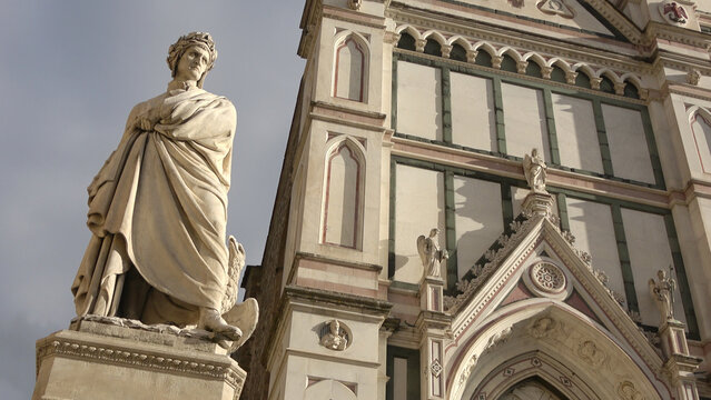 Famous statue of poet Dante Alighieri in front of Basilica Santa Croce Square in Florence Tuscany Italy