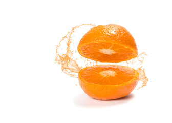 Tangerine cut in half with splashes of juice