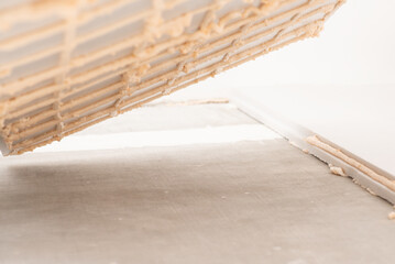 Gluing sheet of styrofoam to the floor. Warming concrete floor of the building