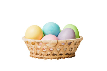 Basket of colorful Easter eggs isolated on white background. Easter basket filled with colored eggs top view holiday concept
