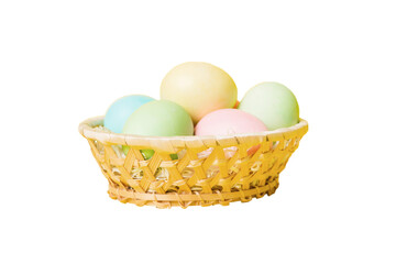 Basket of colorful Easter eggs isolated on white background. Easter basket filled with colored eggs top view holiday concept