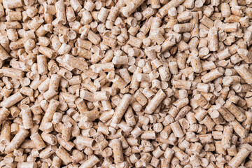 Wood pellets background texture. Alternative biofuel from sawdust.