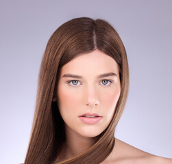 Fototapeta premium Beauty, face portrait and studio woman with natural makeup, luxury facial cosmetics and skincare glow. Dermatology wellness, spa salon and aesthetic model girl isolated on pastel purple background
