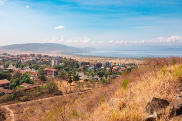 Aerial view of Nakuru Town against the background of Lake Nakuru in Kenya - obrazy, fototapety, plakaty