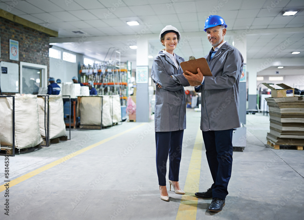 Aufkleber we get every job done to spec. portrait of two managers standing inside a printing and packaging pla