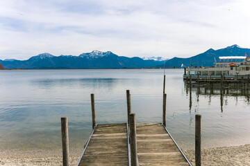 View of the Alps.Alpine lake.Lake near the mountains.Snow in the mountains.Wooden pier.Pier at the...