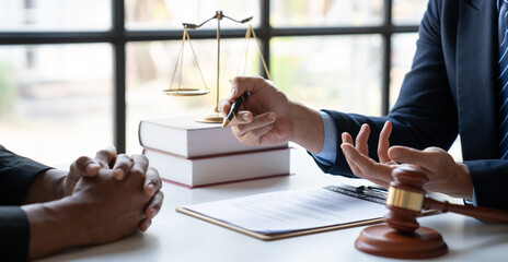 Law concept. Asian young lawyer or legal advisor explaining details Business contract agreement...