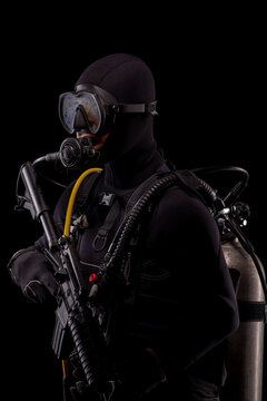 Spec ops police officer SWAT special forces  with a weapon in his hands. on a dark background. Law and order protection concept.  Poster concept for police, security or military