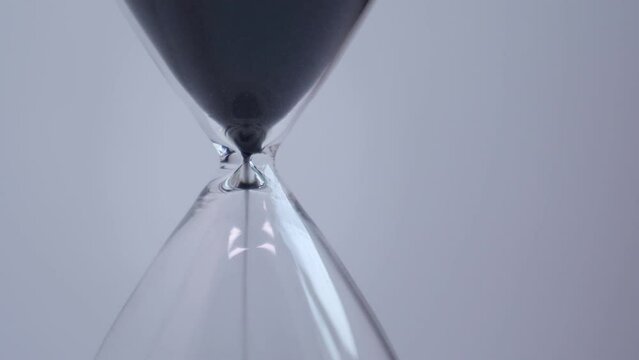 Hourglass with sand - The concept of time. 