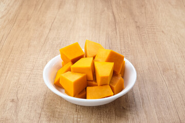 Pumpkin Slice or Labu Kuning on wooden table, food ingredient
