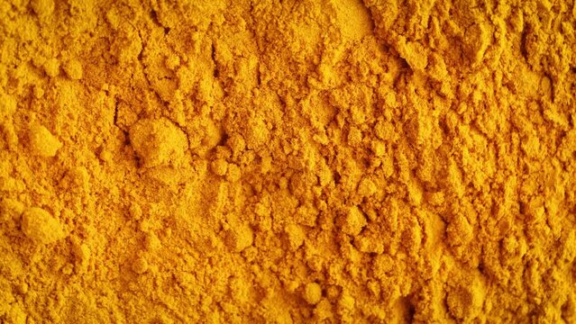turmeric Curcuma yellow dried roots powder background