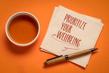 prioritize your wellbeing, inspirational note on a napkin, self care concept