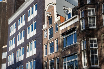 Fototapeta premium Row of Beautiful Old Brick Residential Buildings in Amsterdam Centrum
