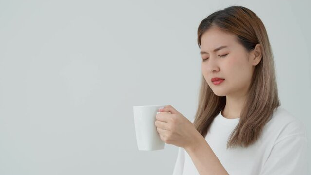 Asian woman feel sensitive teeth after drinking hot, female suffer tooth, decay problems, dental care, tooth extraction, decay problem, bad breath, Gingival Recession, Oral Hygiene instruction