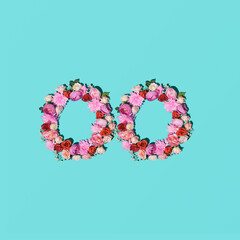 Two round floral frames against turquoise blue background. 