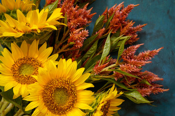 Celosia and sunflowers in an autumn themed bouquet.
