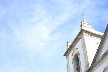 Fototapeta na wymiar bell tower in a sky background