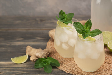 Fresh cocktail prepared with ginger beer, lime and ice. Beverage on the table. Image contains copy space for text. Fresh drink.