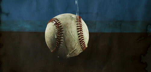 Water on baseball closeup for wet sports weather concept.