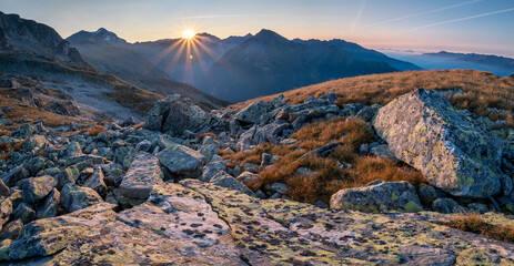 Mountain view at sunset with inversion
in the Austrian Alps in the Hohe Tauern mountains - obrazy, fototapety, plakaty