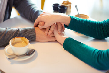 Coffee and romance. two unrecognizable young people on a coffee date.