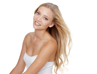Looking fresh-faced and beautiful. A young blonde woman smiling at the camera while isolated on white.