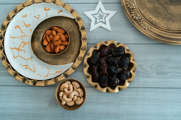 Iftar Food image, fatly image of Dry fruits and nuts on a traditional brass plate