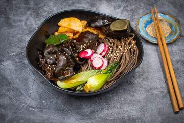 Vegetarian wood ear mushrooms stir fried with bok choy, radish daikon, buckwheat noodles, salted egg