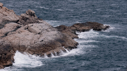 waves crashing on rocks