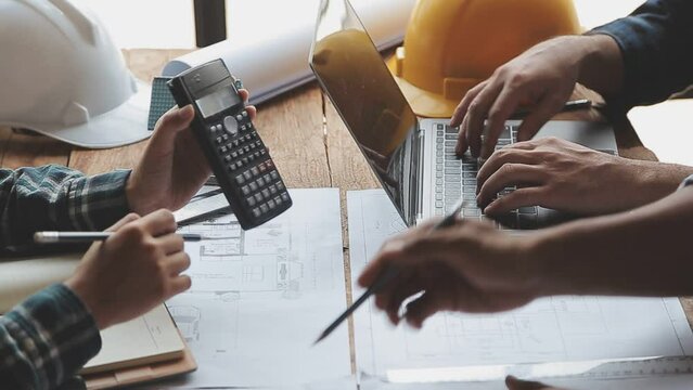 Construction and structure concept of Engineer or architect meeting for project working with partner and engineering tools on model building and blueprint in working site, contract for both companies.