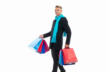 positive shopping man with purchase isolated on white. shopping man with purchase in studio.