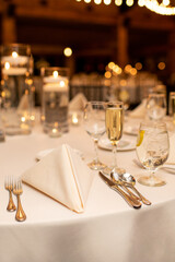 Modern Dinner Table Setting at Event with Lights and Candles and Proper Table Setup
