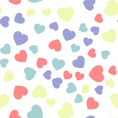 Colorful seamless pattern of pastel red, yellow and blue hearts. Suitable for printing on textile, fabric, wallpapers, postcards, wrappers