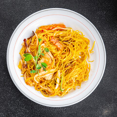 chicken noodles, meat, vegetable meal food snack on the table copy space food background rustic top view