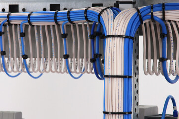 Connection of blocks and modules with an insulated wire on the reverse side of the electrical switchboard. Fastening with plastic mounting ties.