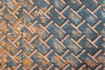 Old, rusty industrial metal floor with Anti-slip pattern left on the surface, corrosion of rust,...