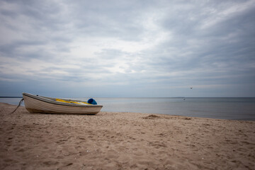 Abounded small boat at the coast of the Baltic Sea in Germany 