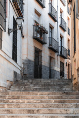Fototapeta na wymiar Staircase on a narrow street in the historic center of Madrid. Slow and city travel concept