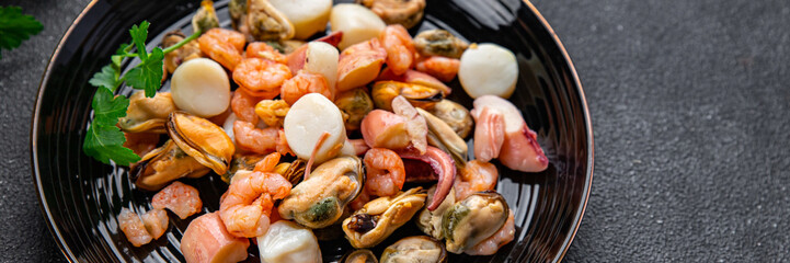 seafood salad shrimp, mussel, scallop, octopus healthy meal food snack on the table copy space food background rustic top view pescatarian diet