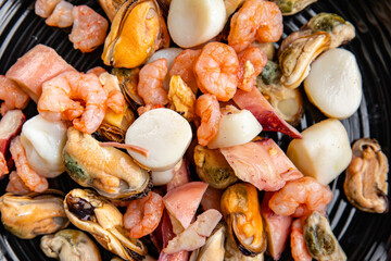 seafood salad shrimp, mussel, scallop, octopus healthy meal food snack on the table copy space food background rustic top view pescatarian diet