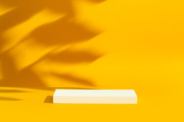 Simple product podium on yellow background