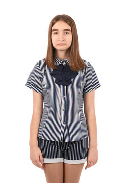 Young beautiful girl in a school uniform on a white background