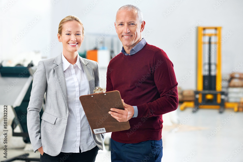 Aufkleber managing the factory with poise and confidence. two warehouse managers on the factory floor.