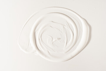 White facial moisturizer on a white isolated background with space to copy. Skin care cream and...