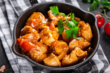 chicken tomato sauce, vegetables healthy meal food snack on the table copy space food background rustic top view