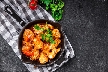 chicken tomato sauce, vegetables healthy meal food snack on the table copy space food background rustic top view